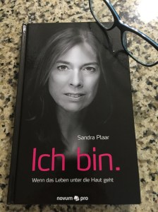 Book cover with photo of author.